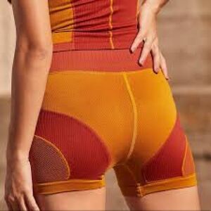 Free People Movement Point Break Shorts in Gold M/L